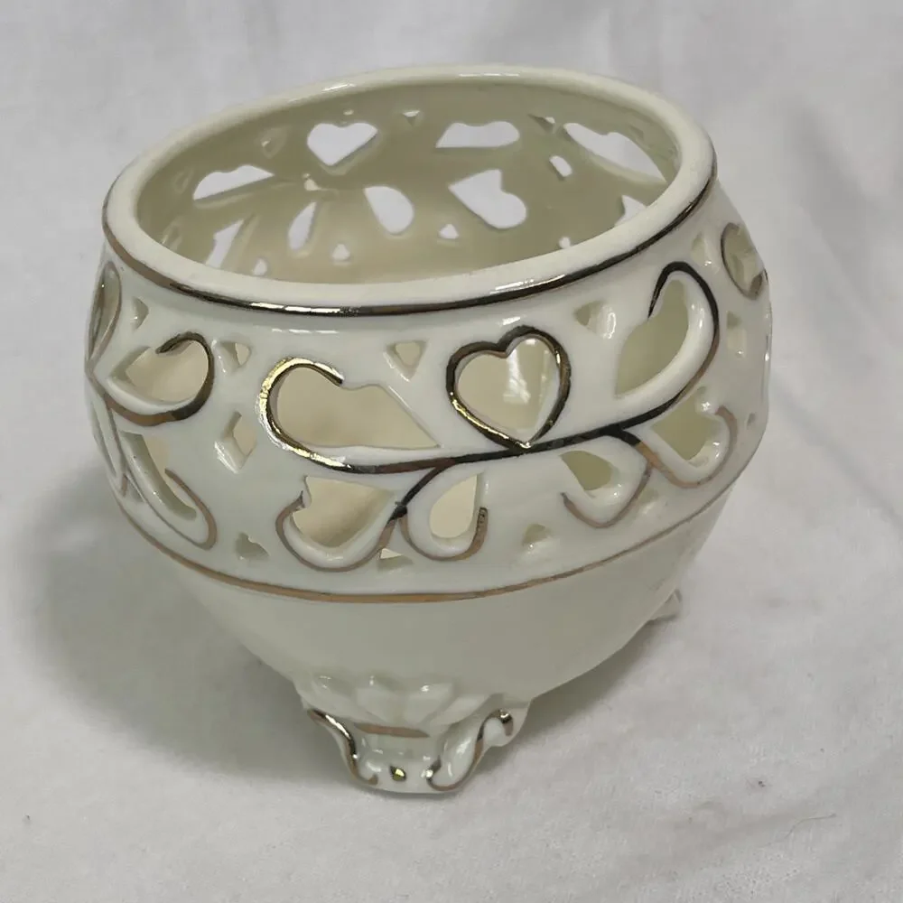 Porcelain Tea Light Holder Cream and Gold Gilding. Three Feet and Cut Outs.